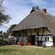 A Tudor style building with a thatch roof